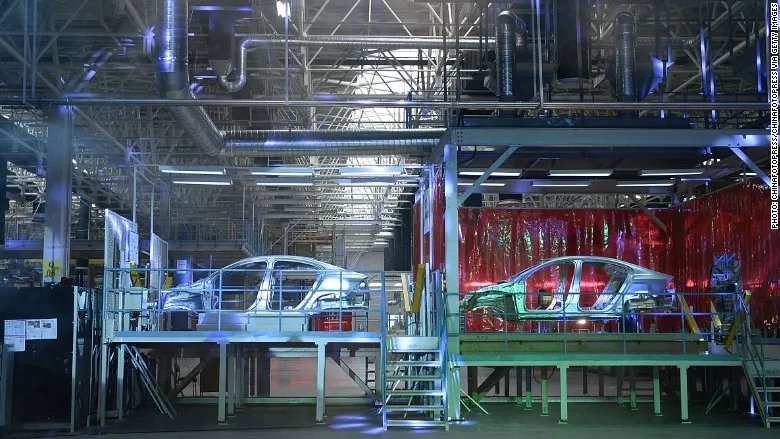 Volvo sweden factory gothenburg life adjusts quiet benefactor rich engines inspects worker wheels cars herald erik abel tribune international choose